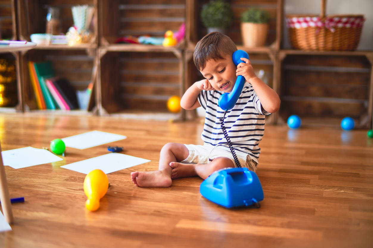 Boy playing with toy phone