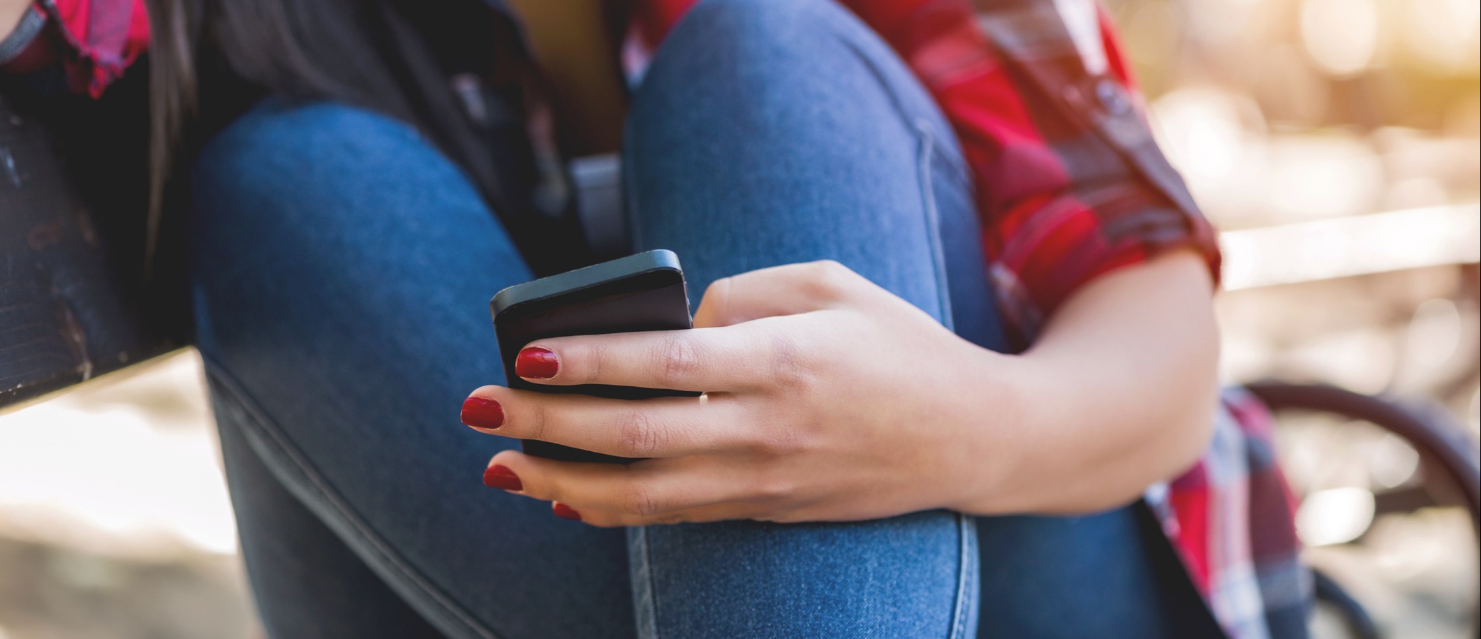 Teenage girl holding a phone